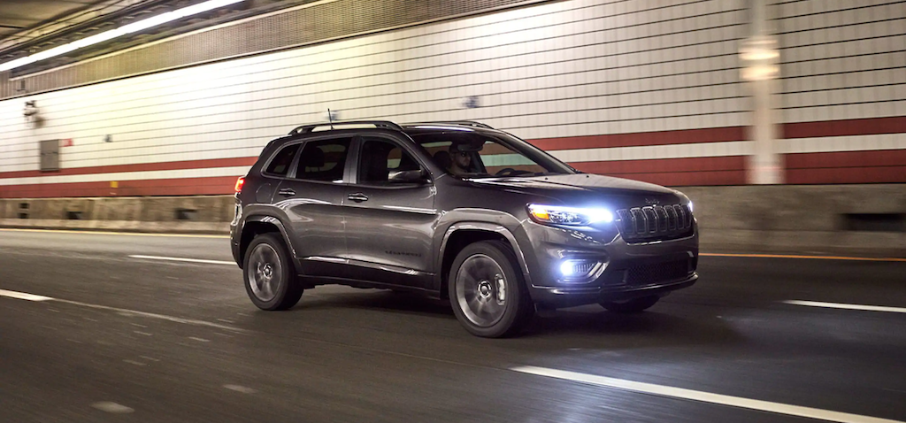 The 2021 Jeep Cherokee driving in a tunnel.