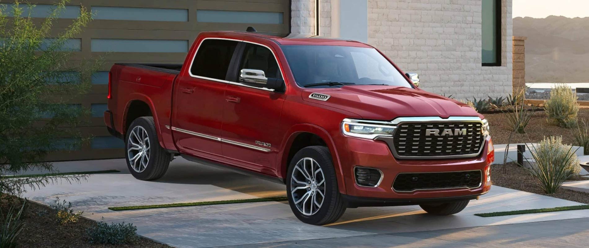 A red RAM 1500 parked in a driveway.