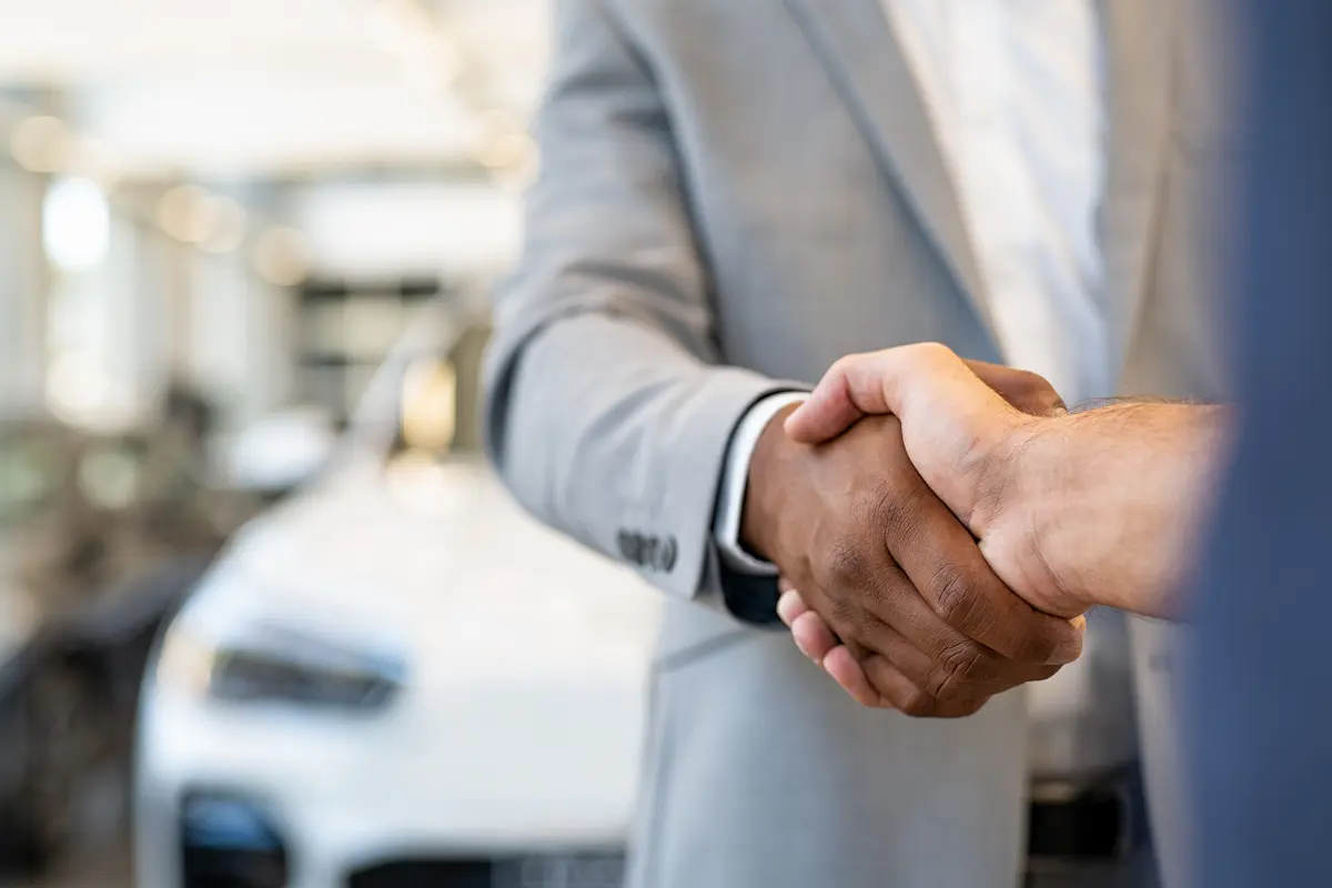 car dealer handshake